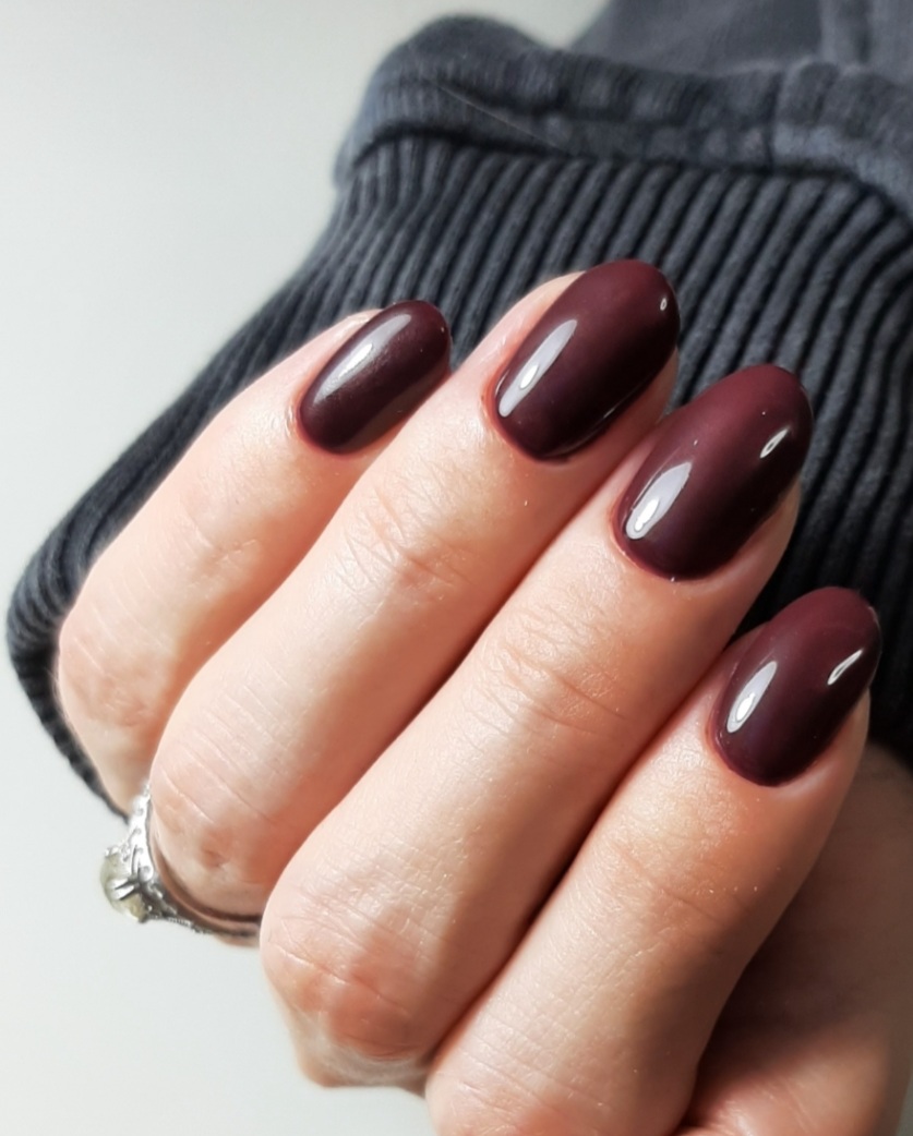 Glossy burgundy almond manicure