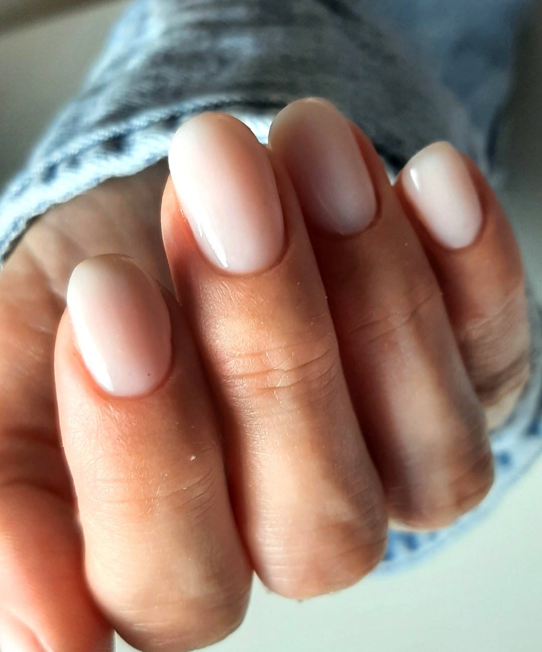 Glossy nude almond manicure